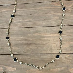 Necklace with black beads and gold tone beads
